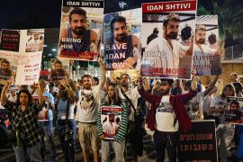 Friend and relatives hold portraits of Israeli hostage Idan Shviti, abducted during the October 7 Hamas attack, at a rally calling for the release of hostages, in Tel Aviv on November 4, 2023. [AHMAD GHARABLI / AFP]