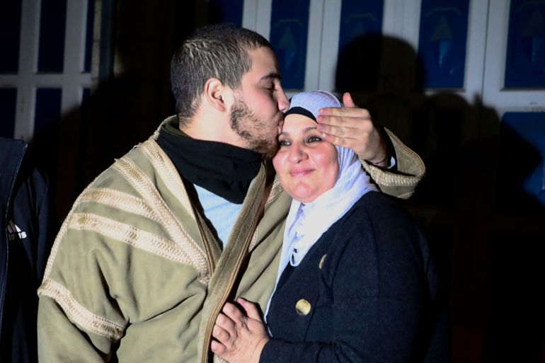 Mohamed Salhab al-Tamimi kisses his mother Fatima