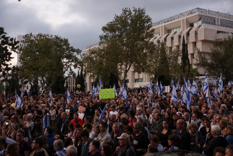 Family members, friends and supporters of Israelis and other nationalities who were taken hostage on October 7 by Hamas during a deadly attack at the final stage of their march from Tel Aviv to Jerusalem, November 18, 2023. [Reuters/Ronen Zvulun]
