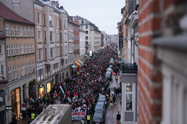 Palestinian flags are seen as people attend a pro-Palestinian rally in front of the Danish parliament Christiansborg in central Copenhagen, Denmark.