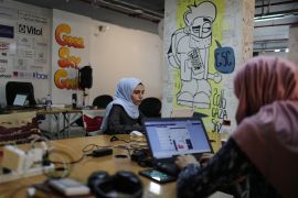 Angham Abu Abed, a Palestinian web developer, works at the Gaza Sky Geeks office in Gaza City on March 16, 2020 [Mohammed Salem/Reuters]