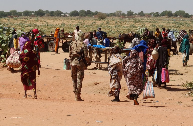 Families escaping Ardamata in West Darfur cross into Adre, Chad, after a wave of ethnic violence