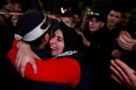 A Palestinian prisoner hugs his mother after being released from Israeli prison, in Ramallah in the occupied West Bank, December 1, 2023 [Ammar Awad/Reuters]