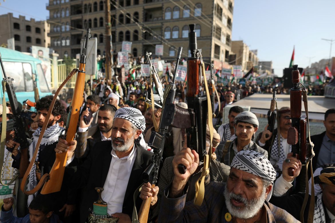 People hold up weapons during a rally to show support to the Palestinians in the Gaza Strip, amid the ongoing conflict between Israel and the Palestinian Islamist group Hamas, in Sanaa, Yemen