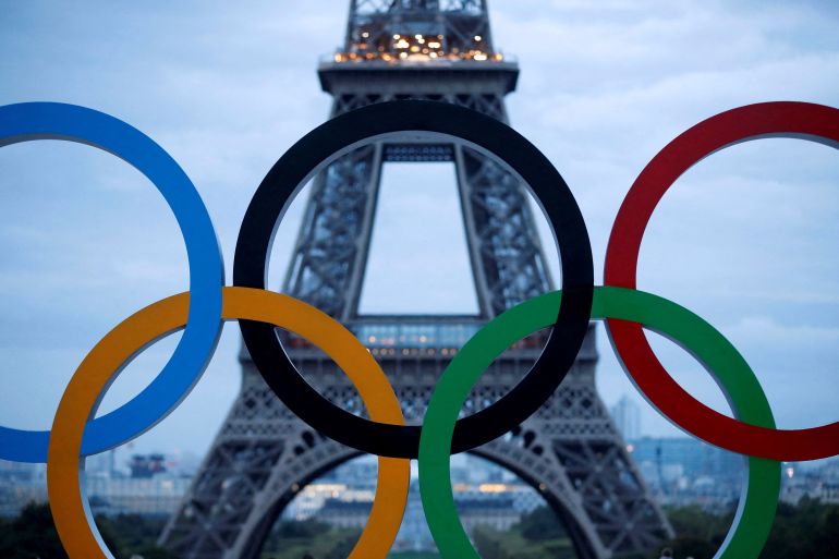 FILE PHOTO: Olympic rings to celebrate the IOC official announcement that Paris won the 2024 Olympic bid are seen in front of the Eiffel Tower at the Trocadero square in Paris, France, September 14, 2017. REUTERS/Christian Hartmann/File Photo/File Photo