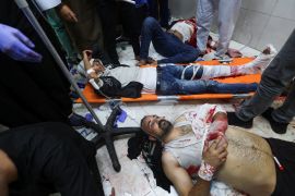 Wounded Palestinians at Nasser hospital, following Israeli strikes on Ma&#039;an school east of Khan Younis. [Ibraheem Abu Mustafa/Reuters]