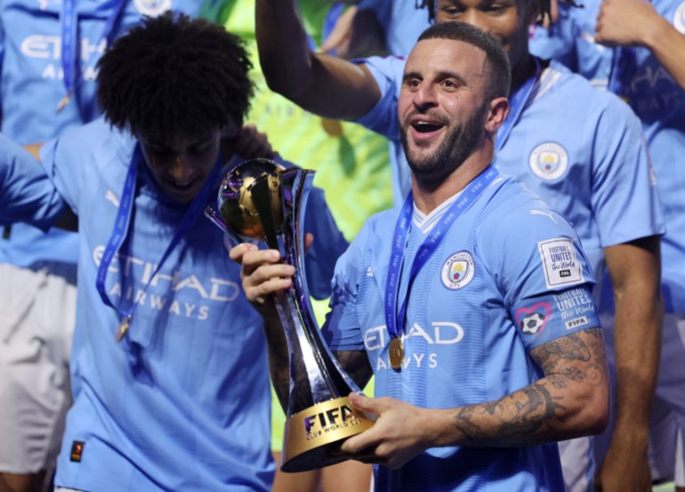 Kyle Walker holds the Club World Cup trophy