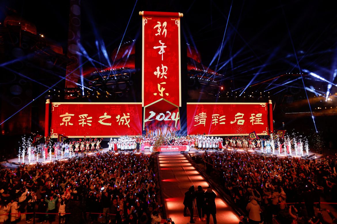 Artists react during the New Year's eve celebration at the Shougang Park in Beijing, China January 1, 2024.