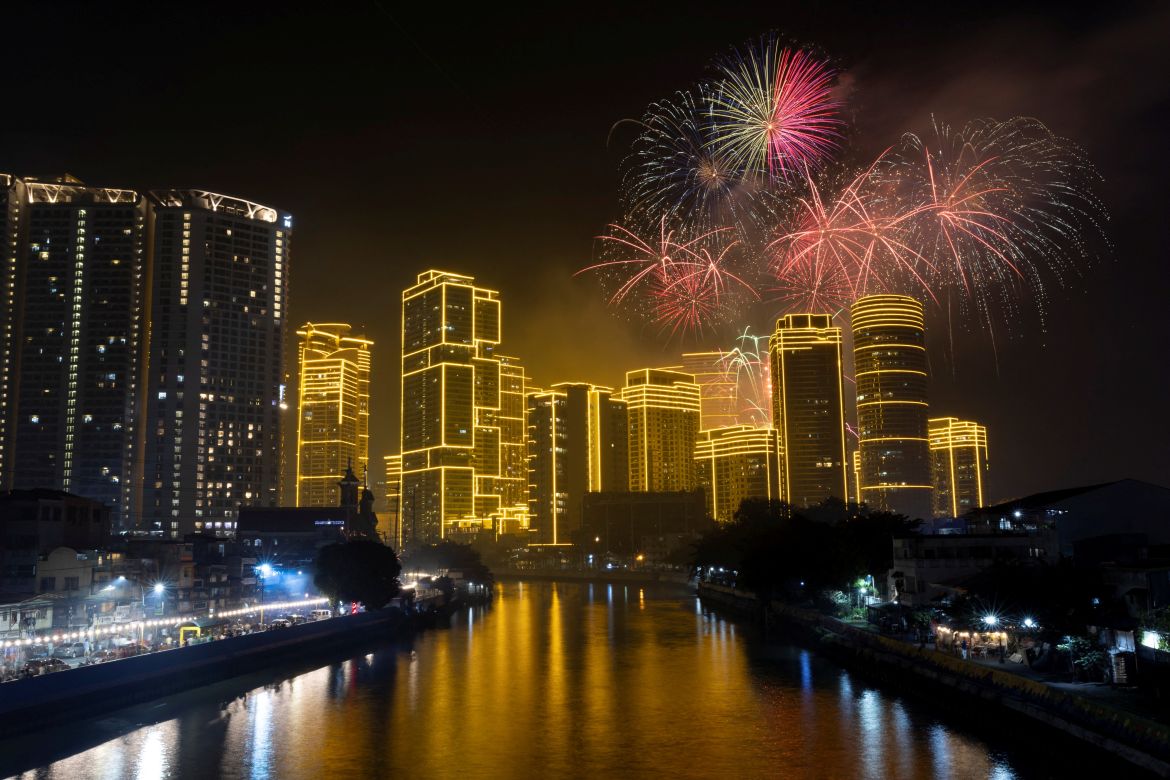 Fireworks explode over Rockwell Center in celebration of the New Year in Makati, Metro Manila, Philippines, January 1, 2024.