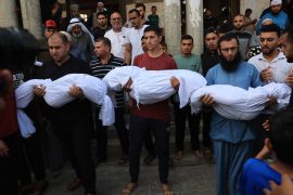 Relatives carry the bodies of children from the Abu Quta family who were killed in Israeli strikes on the Palestinian city of Rafah in the southern Gaza Strip, during their funeral.