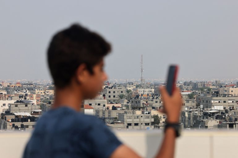 An antenna of a communications tower that relays phone and internet signals is pictured in Rafah