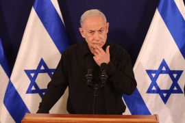 Netanyahu is the first serving Israeli president to face criminal charges. [File: Abir Sultan/AFP]