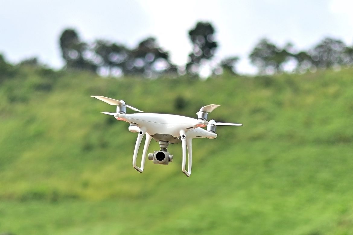This picture taken on November 22, 2023 shows a drone being flown by Chiang Mai University's Forest Restoration Research Unit (FORRU) field research officer Worayut Takaew during a mapping survey of a reforested area on a hillside near Chiang Mai.