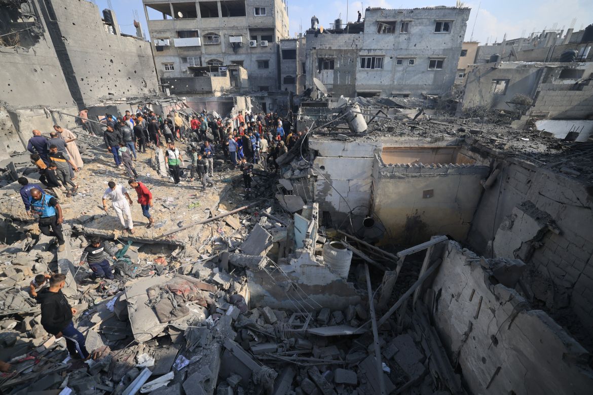 Palestinians check the damage of houses destroyed in an Israeli strike on Khan Yunis in the southern Gaza Strip.