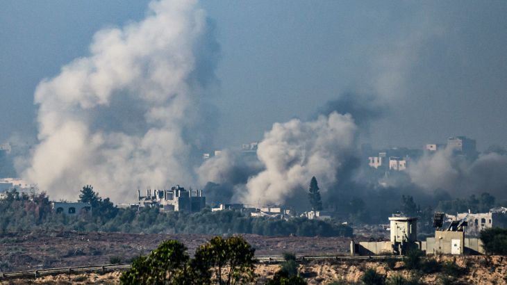 This picture taken from the northern Gaza Strip shows smoke rising from buildings still after being hit by Israeli strikes in the battles between Israel and Hamas.