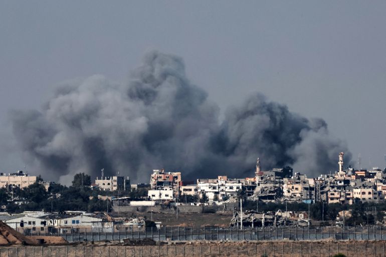 Smoke rising above buildings during an Israeli strike in northern Gaza