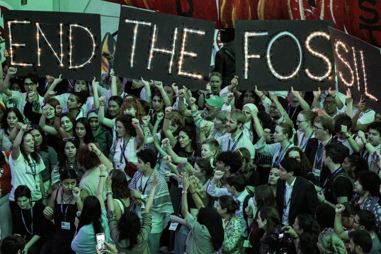 Protesters at COP28 calling for an end to fossil fuels