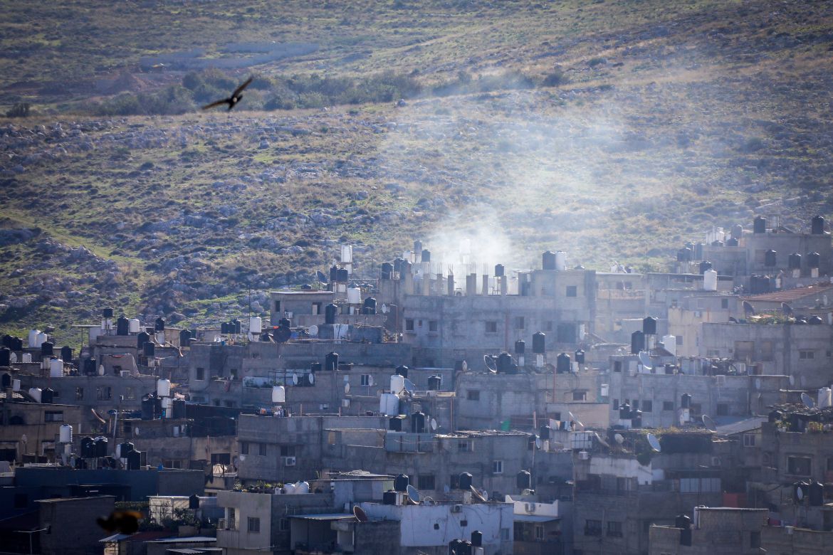 Smoke billows during an Israeli military raid at the Nur Shams camp for Palestinian refugees near the northern city of Tulkarm in the occupied West Bank on December 17
