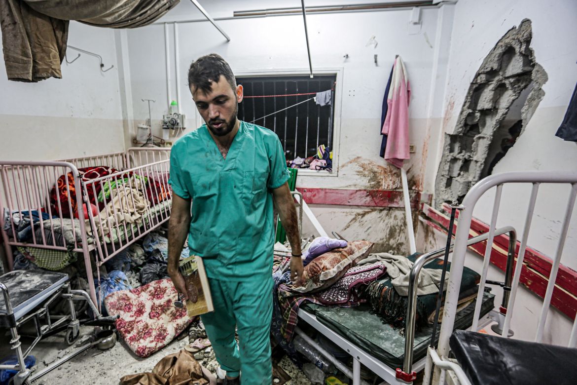 A man inspects the damage in a room following Israeli bombardment at Nasser hospital in Khan Yunis in the southern Gaza Strip.
