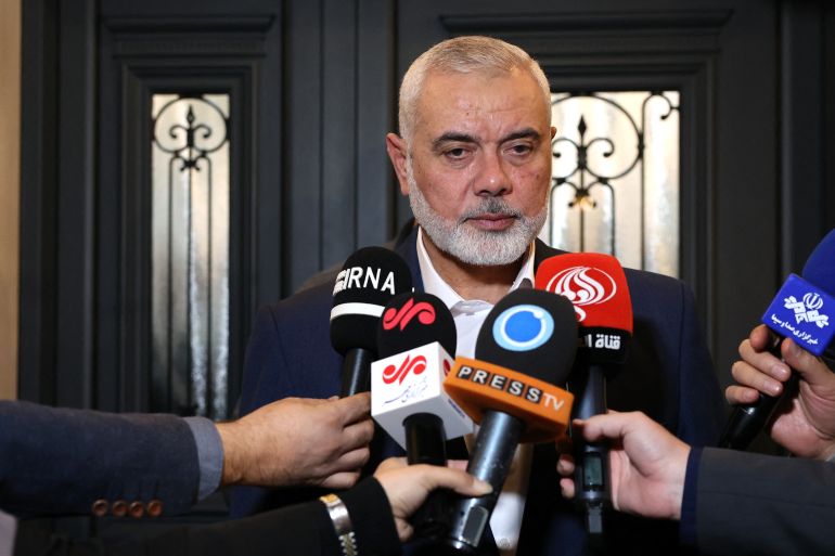 This handout picture provided by the Iranian foreign ministry on December 20, 2023, shows Qatar-based Hamas leader Ismail Haniyeh speaking to journalists as he welcomes the Iranian foreign minister (not in the picture), in Doha. (Photo by Iranian Foreign Ministry / AFP) / XGTY / XGTY / === RESTRICTED TO EDITORIAL USE - MANDATORY CREDIT "AFP PHOTO / HO / IRANIAN FOREIGN MINISTRY" - NO MARKETING NO ADVERTISING CAMPAIGNS - DISTRIBUTED AS A SERVICE TO CLIENTS === - XGTY / XGTY / === RESTRICTED TO EDITORIAL USE - MANDATORY CREDIT "AFP PHOTO / HO / IRANIAN FOREIGN MINISTRY" - NO MARKETING NO ADVERTISING CAMPAIGNS - DISTRIBUTED AS A SERVICE TO CLIENTS === /
