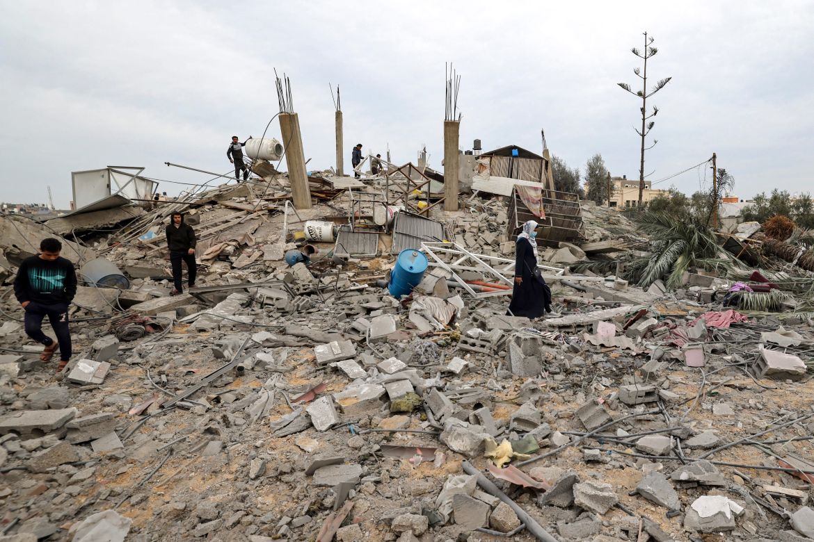 Palestinians check the rubble following Israeli bombardment in Rafah in the southern Gaza Strip on December 21, 2023, amid continuing battles between Israel and the militant group Hamas.