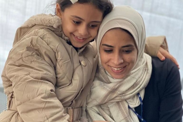 The author with her eight-year-old daughter at the Al Aqsa Martyrs Hospital in Deir el-Balah, Gaza Strip, on November 30, 2023 — less than a day before Israel's bombing started again [Maram Humaid/Al Jazeera]