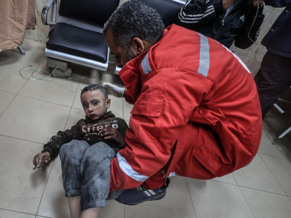 An injured Palestinian child is taken to the Al-Aqsa Martyrs Hospital to receive treatment after Israeli attacks in Deir al-Balah, Gaza,