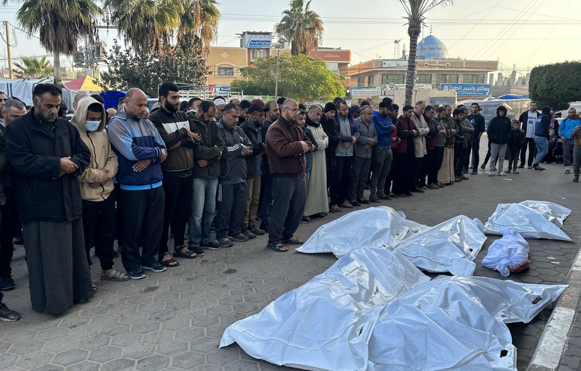 Relatives perform funeral prayers for five members of the Sabah family, killed in Israeli strikes in Deir al-Balah, on Saturday