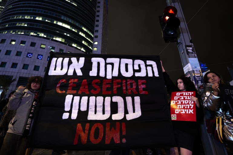 Israeli activists gather in front of Ministry of Defense to protest the attacks on Gaza and call for ceasefire in Tel Aviv, Israel on December 05