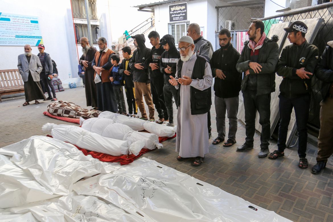 People attend the funeral ceremony for the Palestinians died in Israeli attacks, as the bodies are taken by their relatives from the morgue of An-Najjar Hospital to be buried in Rafah, Gaza.