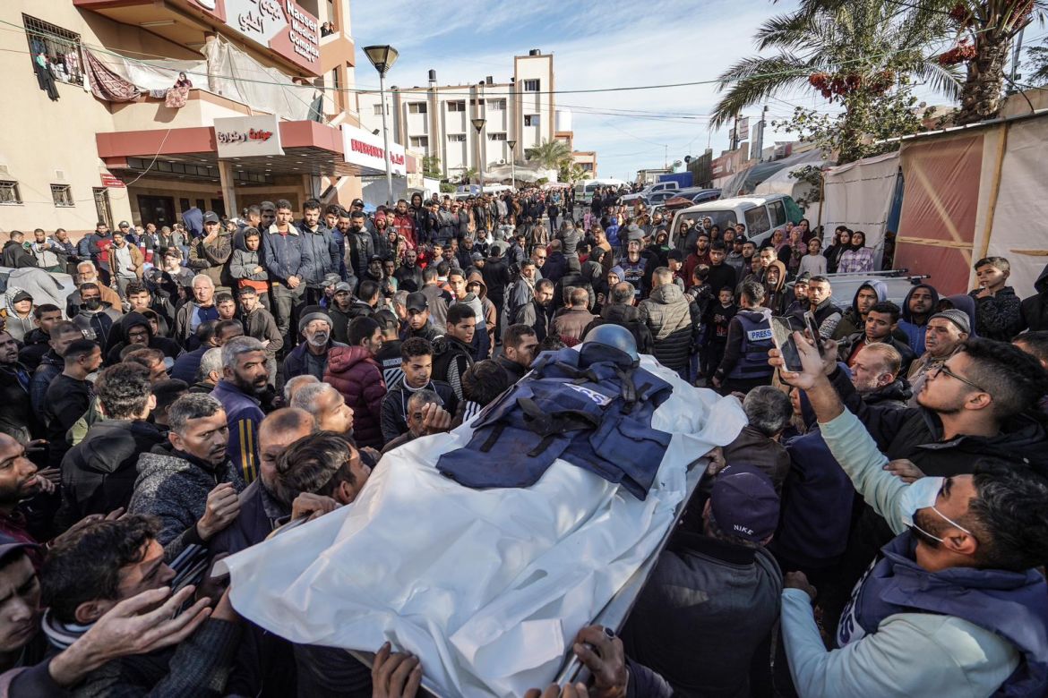 People attend the funeral ceremony of Al Jazeera cameraman Samir Abu Dhaka, who died in the Israeli attacks in Khan Yunis, Gaza on December 16
