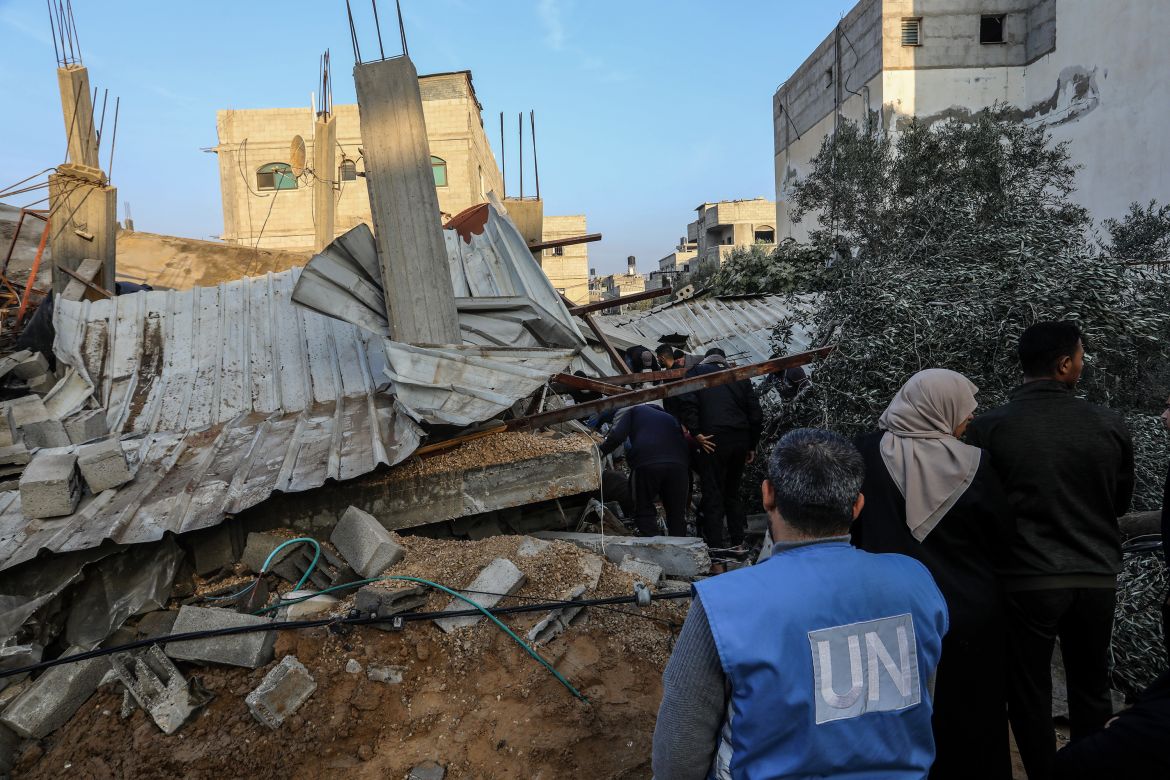 Civil defense teams carry out search and rescue operations under debris of destroyed buildings after Israeli airstrike in Rafah, Gaza on December 17
