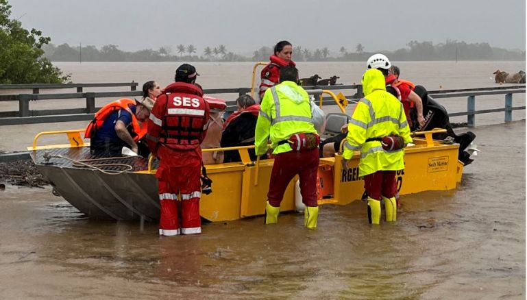 Personnel conduct search and rescue operations in the flooded area in Queensland, Australia on December 18