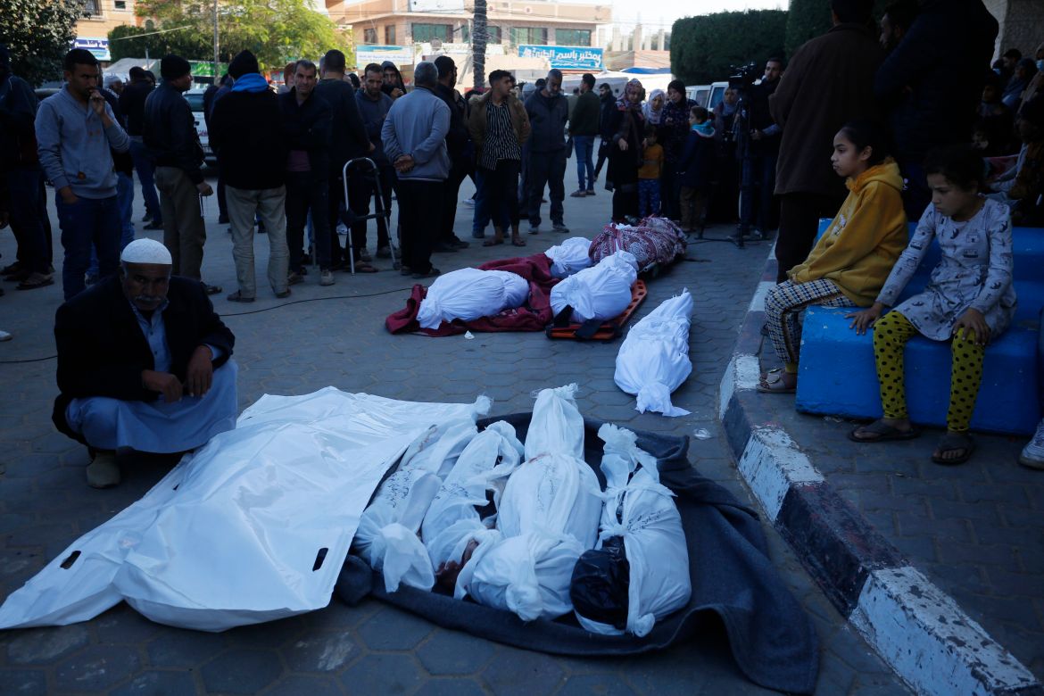 Relatives of the Palestinians died in Israeli attacks, mourn as they receive the dead bodies from the morgue of Al-Aqsa Martyrs Hospital while the Israeli attacks continue in Deir Al Balah, Gaza on December 19