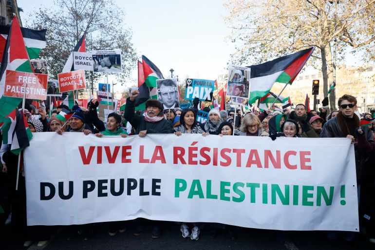 People chant slogans holding banners that reads « Long live the resistance of the Palestinian people" during a pro-Palestinian rally, in Paris, Saturday, Dec. 2