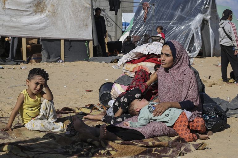 Palestinians displaced by the Israeli bombardment of the Gaza Strip set up a tent camp in Rafah