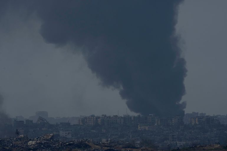 Smoke rises following an Israeli bombardment in the Gaza Strip, as seen from southern Israel,, Friday, Dec. 8