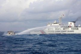 In this handout photo provided by the Philippine Coast Guard, a Chinese Coast Guard ship uses water cannons on Philippine navy-operated supply boat M/L Kalayaan as it approaches Second Thomas Shoal.