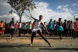 Young dancers perform, during a Christmas ballet event in Kibera