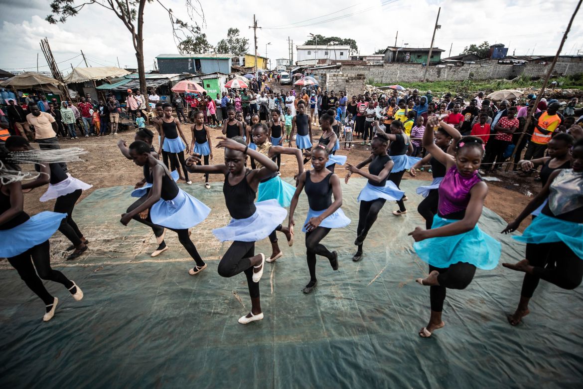 Young dancers practice by the Kenya - Uganda railway line
