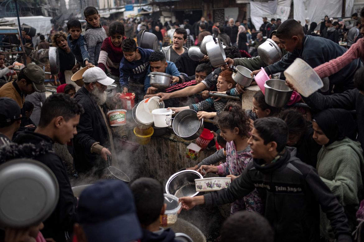 Palestinians line up for a free meal in Rafah, Gaza Strip.
