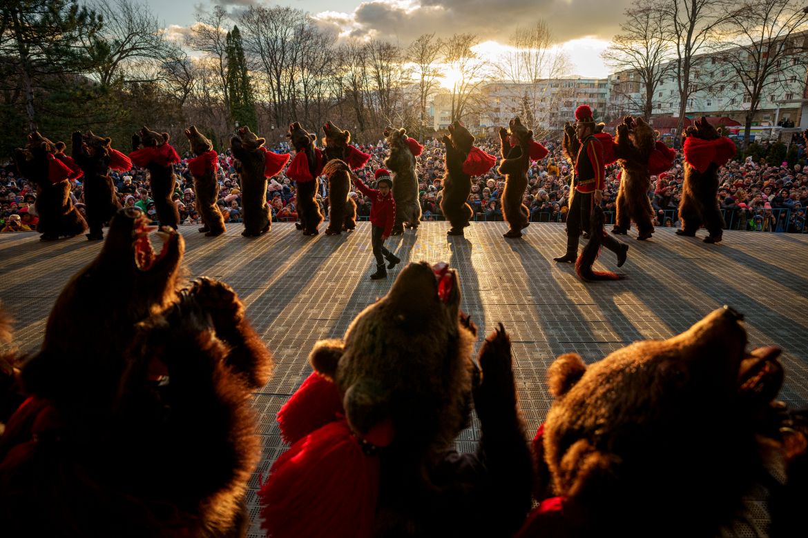 Members of a traditional bear pack perform in a festival in Moinesti, northern Romania, Wednesday, Dec. 27