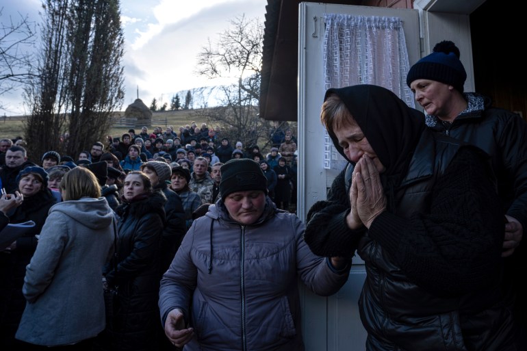 A mother mourning her son who was killed fighting for Ukraine in the war against Russia 