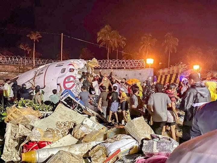Brown cartons getting drenched in rain on August 20, 2020, at a crash site of Air India Express flight from Dubai in Kozhikode, Kerala. The crash killed 20, including two pilots [Rejimon Kuttappan/Al Jazeera]