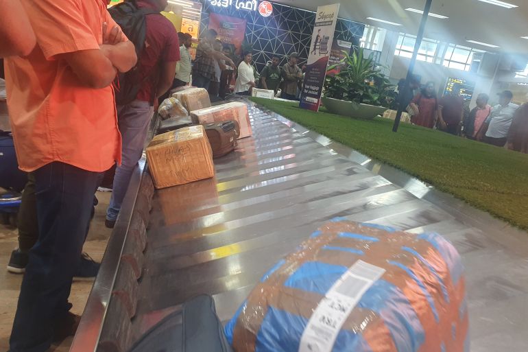 Brown cartons moving along with other suitcases from Bahrain on the conveyor belt at Thiruvananthapuram International Airport on October 31