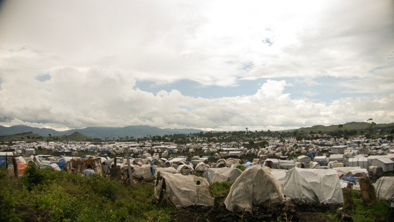 Makeshift tents roll on endlessly in Bulengo camp