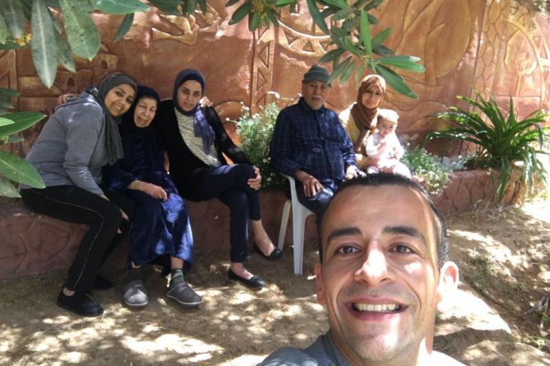 Palestinian Eman Radwan's family poses for a family picture. Her father, mother and brother were killed during Israel's bombardment of Gaza.