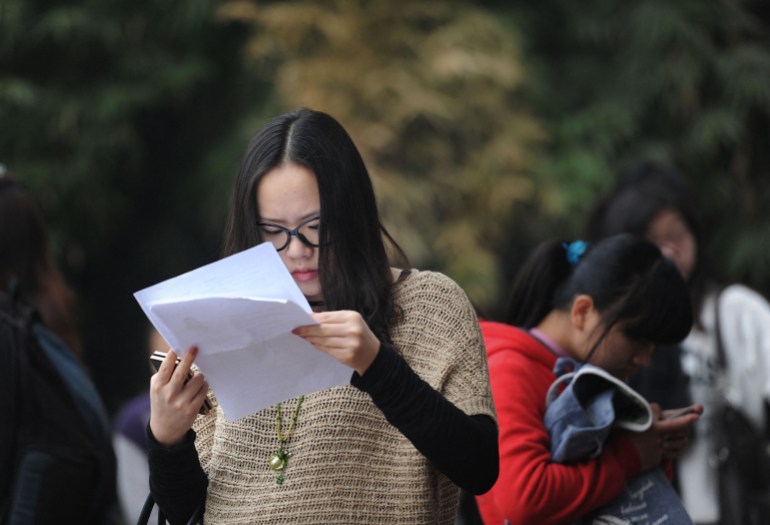 A candidate makes last minute preparations to sit for the Chinese civil service examinations, where nationwide 133 million candidates sit for the exam to qualify for some 18,000 job vacancies in the government, in Hefei, east China's Anhui province on November 27, 2011. A Chinese firm has decided Scorpios and Virgos are too moody and critical, telling job seekers with those star signs they need not apply. Capricorns, Pisces and Libras, on the other hand, are welcome. CHINA OUT AFP PHOTO (Photo by AFP)