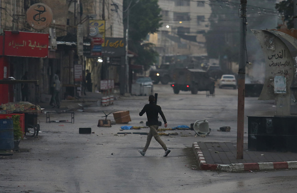 A view of the street as the clash breaks out between Palestinians and Israeli forces following the raid, conducted by Israeli army, on Jenin refugee camp in Jenin, West Bank on December 5.
