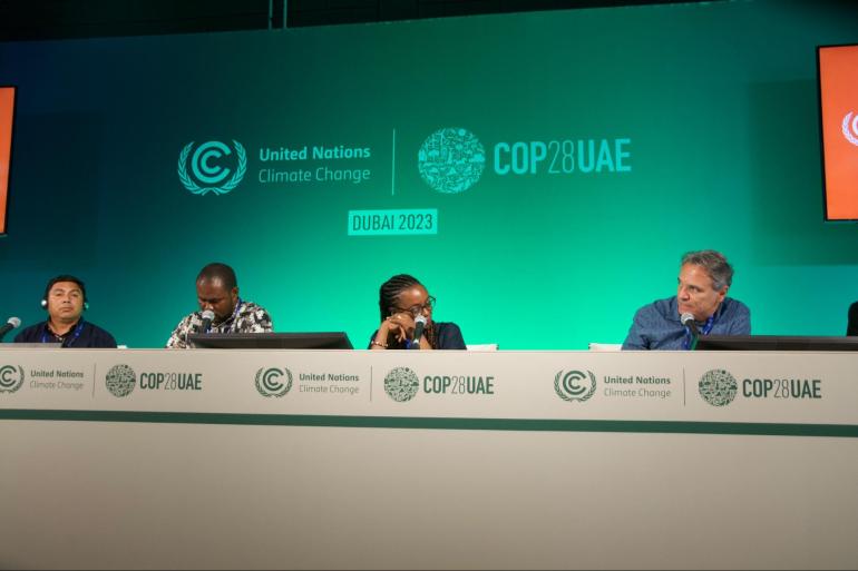 Selvyn Pérez,president of the Utz’ Che’ Community Forestry Network of Guatemala, Dominik T-Johns, convener for the REDD+ Technical Working Group in Liberia, Mary Molokwu-Odozi, a REDD+ project manager also in Liberia and Beto Borges of NGO Forest Trends at a COP28 side event on 6 December 2023. (Photo: Paula Dupraz-Dobias)